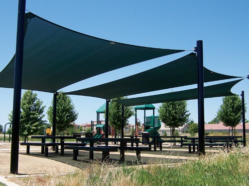 Sun shade sail canopy covering outdoor picnic area at Manuel Barandas Park