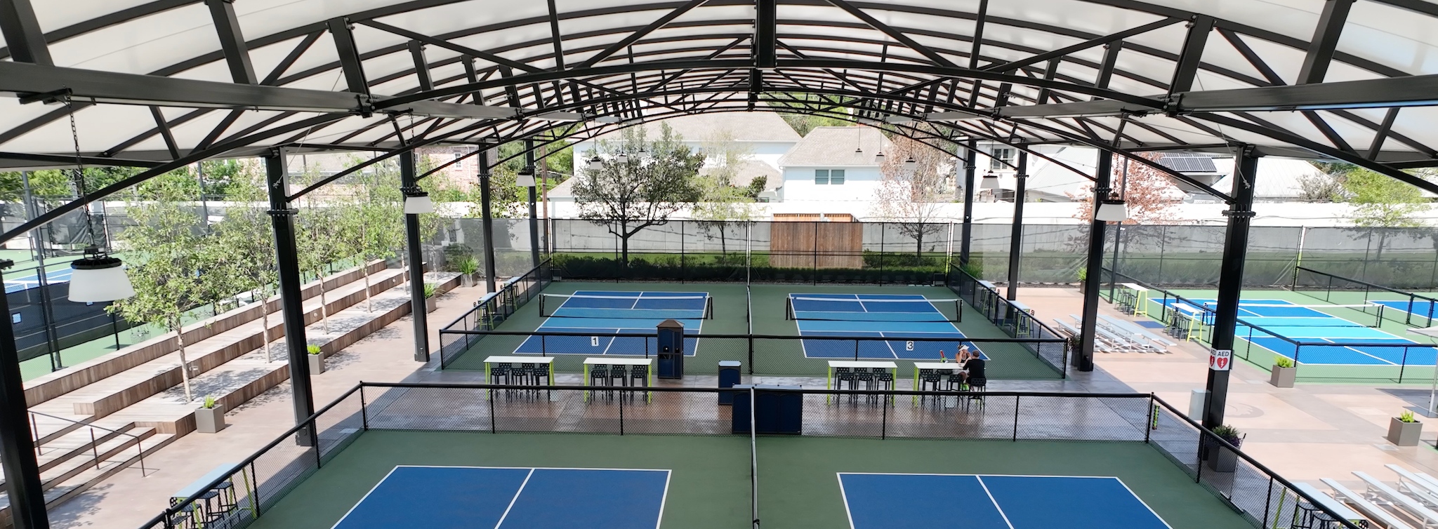 pickleball courts covered with shade structure, interior view