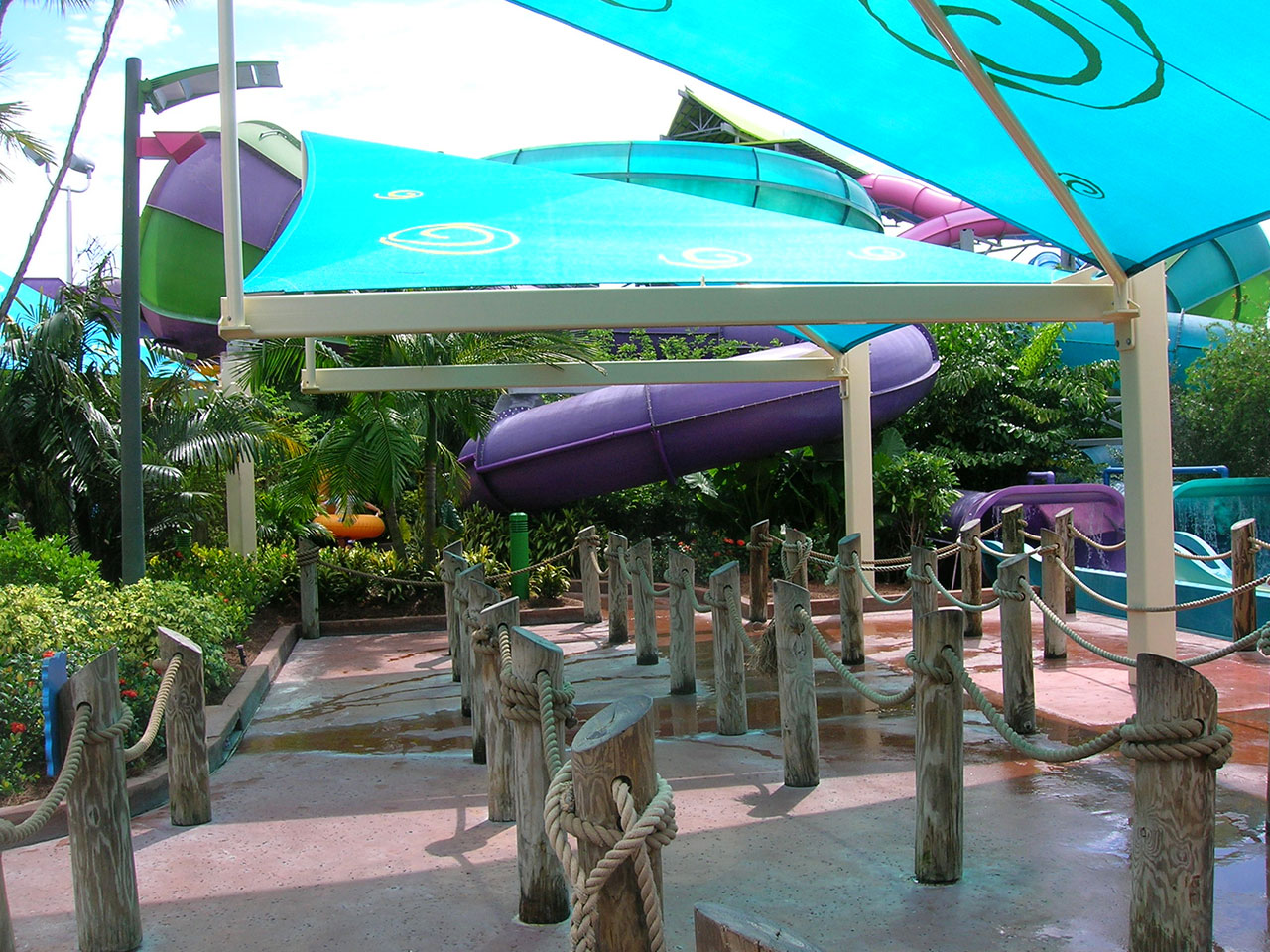 Commercial shade sail covering Aquatica Sea World Waterpark waterslide queue